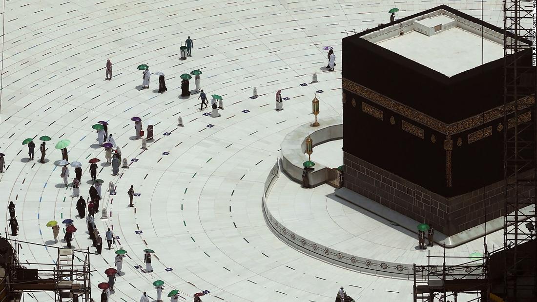 Worshippers walk around the Kaaba, Islam&#39;s holiest shrine, at the Grand Mosque in Mecca, Saudi Arabia, on Tuesday, July 20.