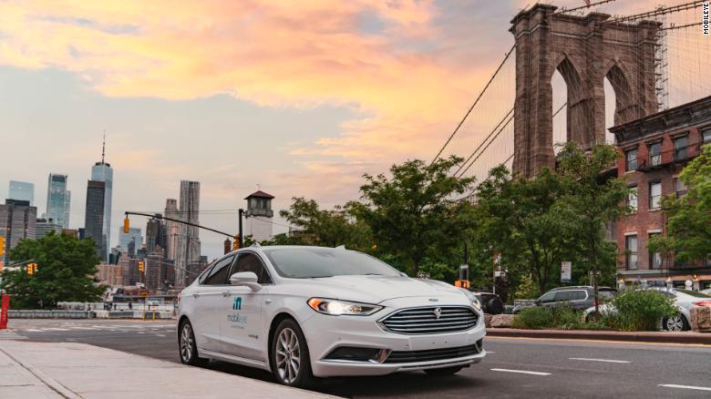 A self-driving vehicle from Mobileye's autonomous test fleet sits parked in front of the Manhattan Bridge in June 2021. Mobileye tests its technology in complex urban areas in preparation for future driverless services. (Credit: Mobileye, an Intel Company)