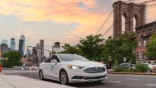 A self-driving vehicle from Mobileye&#39;s autonomous test fleet sits parked in front of the Manhattan Bridge in June 2021. Mobileye tests its technology in complex urban areas in preparation for future driverless services. (Credit: Mobileye, an Intel Company)