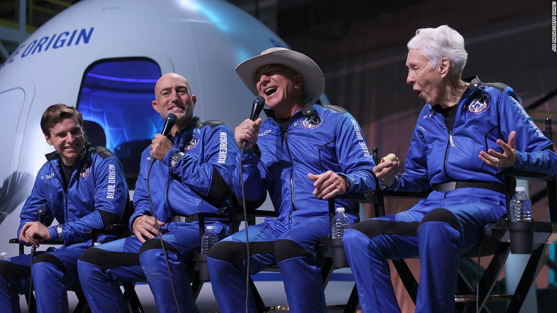 From left, Oliver Daemen, Mark Bezos, Jeff Bezos and Wally Funk hold a news conference after flying into space. &quot;My expectations were high, and they were dramatically exceeded,&quot; Jeff Bezos said.