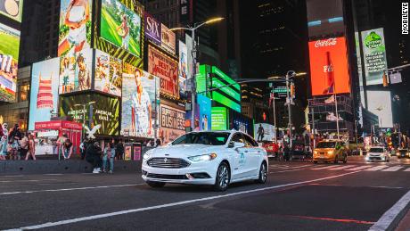A self-driving vehicle from Mobileye&#39;s autonomous test fleet navigates New York City&#39;s Times Square in June 2021.