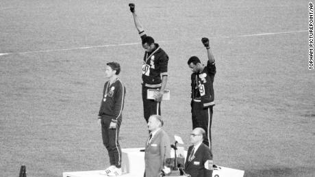 In one of the most well-known Olympic protests, US gold and bronze medalists Tommie Smith (center) and John Carlos (right) raised their fists as a &quot;Black Power&quot; gesture during a 1968 medal ceremony in Mexico City.  