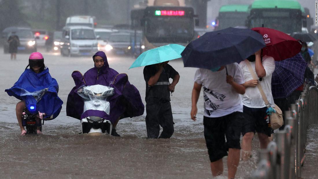 Passengers trapped inside submerged subway in China floods