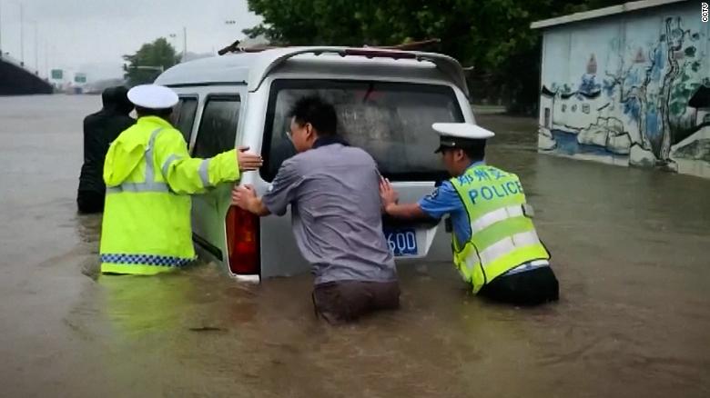 The heavy flooding submerged roads and swept cars away.