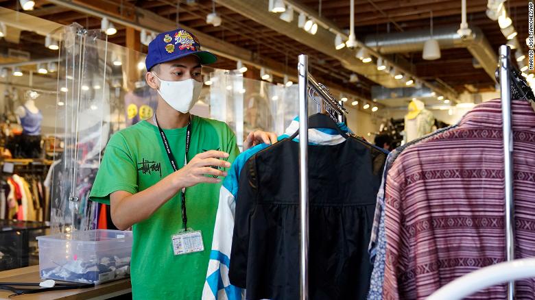 An employee sorts a rack at 2nd Street second hand store in the Fairfax district of Los Angeles. 