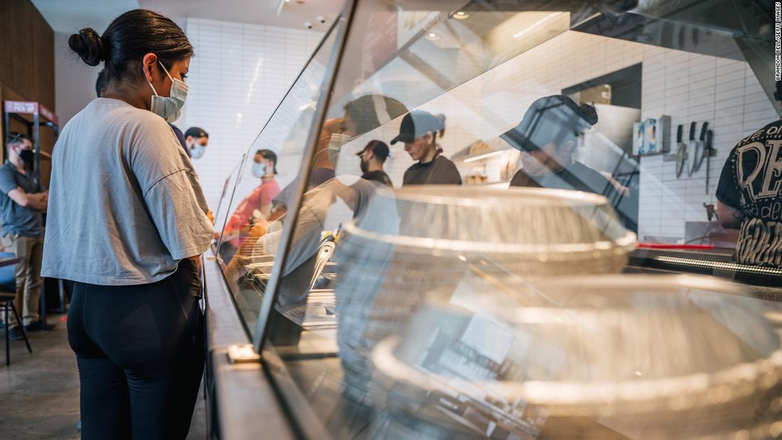 Restaurants are short on staff. Chipotle says raising wages helps