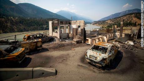 Burned cars and structures are seen in Lytton, British Columbia, on Friday, July 9, 2021.