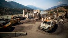 Burned cars and structures are seen in Lytton, British Columbia, on Friday, July 9, 2021.