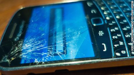 For a variety of reasons people with cracked Blackberry or Smartphone screens continue to use them if still functional seen February 24, 2014, in Washington, DC.      AFP PHOTO/Paul J. Richards        (Photo credit should read PAUL J. RICHARDS/AFP via Getty Images)