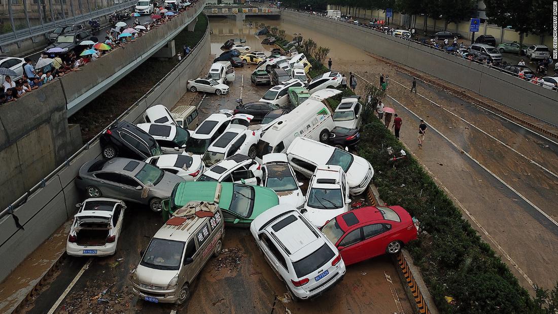 Death toll from China floods jumps to 302, as Covid outbreak complicates recovery