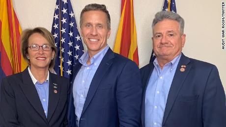Former Missouri Governor Eric Greitens, (center) currently running for a seat in the US Senate, poses with Arizona State Senators Wendy Rogers and Sonny Borrelli ahead of his June 12 visit to the audit site of the Arizona Senate. 