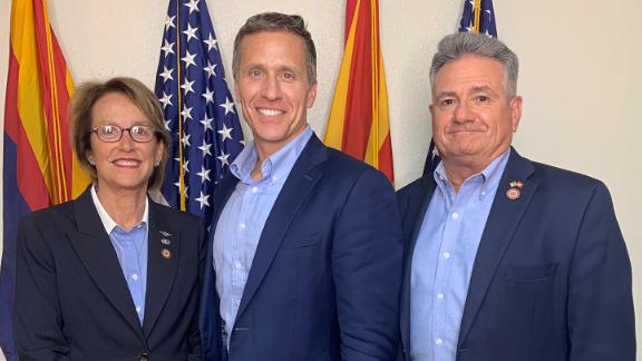 Former Missouri Gov. Eric Greitens, (center) now running for a US Senate seat, poses with Arizona state senators Wendy Rogers and Sonny Borrelli before his June 12 tour of the Arizona Senate's audit site. 