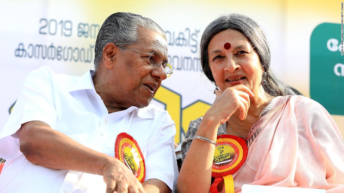 Chief Minister Pinarayi Vijayan with an activist during the 
