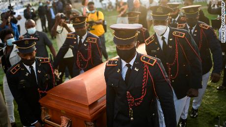 Police carry the coffin of slain Haitian President Jovenel Moise at the start of the funeral at his family home in Cap-Haitien, Haiti, early Friday, July 23, 2021. Moise was assassinated at his home in Port-au-Prince on July 7. (AP Photo/Matias Delacroix)