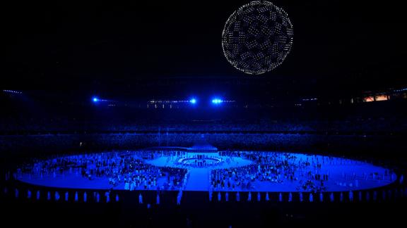 During one portion of the opening ceremony, there were 1,800 drones flying over the stadium to form a globe in the night sky. As the glowing drones soared over the stadium, performers sang 