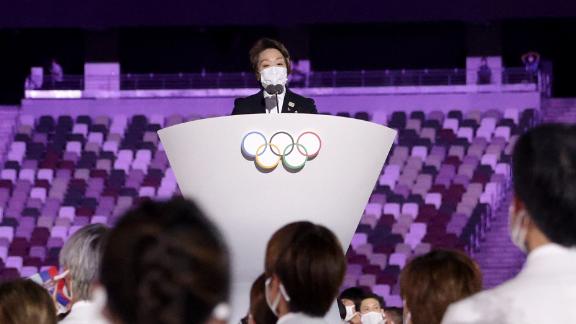 Seiko Hashimoto, president of the Tokyo 2020 organizing committee, makes a speech during the opening ceremony. At left is Thomas Bach, president of the International Olympic Committee.