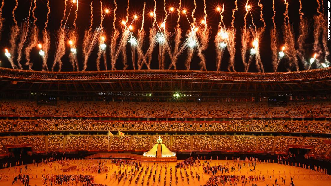 Fireworks go off after Osaka lit the Olympic cauldron.