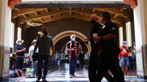 LOS ANGELES, CALIFORNIA - JULY 19: People wear face coverings as they gather in Union Station on July 19, 2021 in Los Angeles, California. A new mask mandate went into effect just before midnight on July 17 in Los Angeles County requiring all people, regardless of vaccination status, to wear a face covering in public indoor spaces amid a troubling rise in COVID-19 cases. (Photo by Mario Tama/Getty Images)