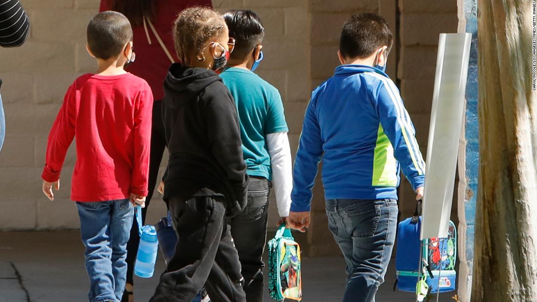 At least nine of the 20 largest US school districts are making masks optional for students