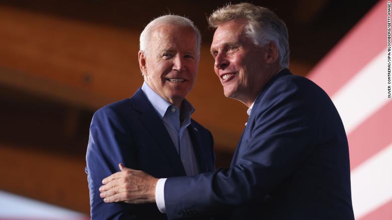 President Joe Biden, left, shakes hands with Terry McAuliffe, Democratic gubernatorial candidate for Virginia, during a campaign event in Arlington, Virginia, on Friday, July 23, 2021.