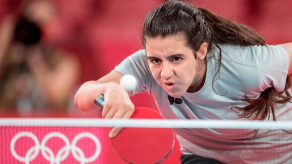 Twelve-year-old Syrian Hend Zaza is seen in action during the women's singles table tennis event on July 24. Zaza, the youngest Olympian competing in the Tokyo Games, was knocked out of the competition on Saturday morning, losing 4-0 in the preliminary round to Austrian Jia Liu, 27 years her elder.