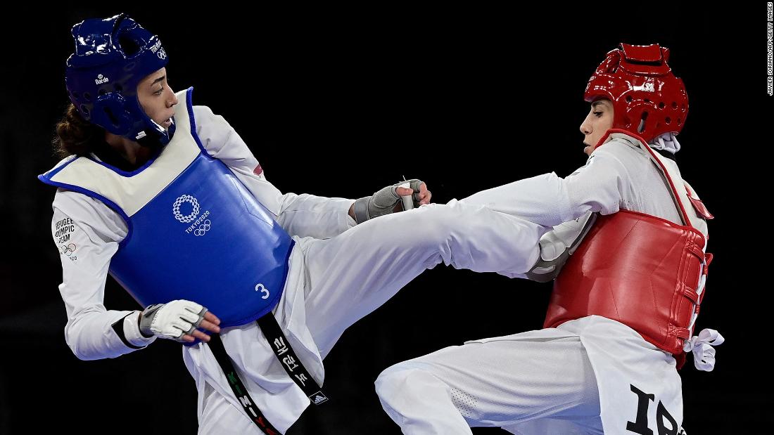 Kimia Alizadeh, a taekwondo athlete representing the Olympic Refugee Team, kicks Iran&#39;s Nahid Kiyani Chandeh during her first match on July 25. Alizadeh was born in Iran and became the country&#39;s first female athlete to win an Olympic medal when she won bronze at the 2016 Games. But &lt;a href=&quot;https://edition.cnn.com/2021/03/03/sport/kimia-alizadeh-tokyo-olympics-iran-white-flag-refugee-spt-intl/index.html&quot; target=&quot;_blank&quot;&gt;she defected last year&lt;/a&gt; amid searing criticism of the regime in Tehran. Alizadeh defeated Chandeh 18-9.