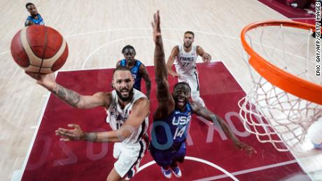 France&#39;s Evan Fournier goes for the basket past USA&#39;s Draymond Green at the Saitama Super Arena in Saitama, Japan, on Sunday, July 25.