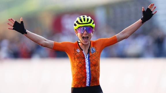 Dutch cyclist Annemiek van Vleuten celebrates after completing the road race on July 25. She <a href=