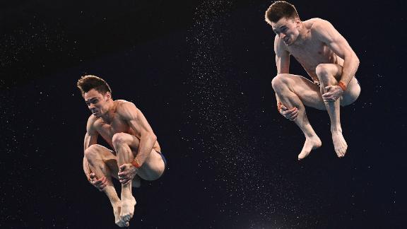 British divers Tom Daley, left, and Matty Lee compete in the synchronized 10-meter platform event on July 26. They won the gold.