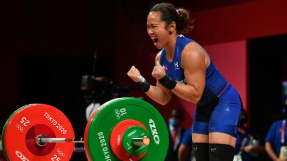 The Philippines' Hidilyn Diaz reacts after winning the 55-kilogram weightlifting competition on July 26. It's her country's <a href=