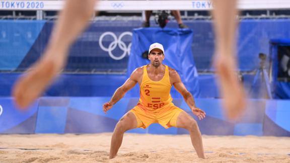 Spain's Adrian Gavira Collado waits for a serve during a beach volleyball match on July 26.