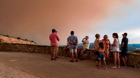Locals watch fires spread in Sant Martí de Tous, Catalonia.