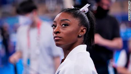 Simone Biles, of the United States, waits for her turn to perform during the artistic gymnastics women&#39;s final at the 2020 Summer Olympics, Tuesday, July 27, 2021, in Tokyo. (AP Photo/Gregory Bull)