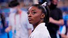 Simone Biles, of the United States, waits for her turn to perform during the artistic gymnastics women&#39;s final at the 2020 Summer Olympics, Tuesday, July 27, 2021, in Tokyo. (AP Photo/Gregory Bull)