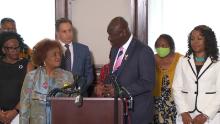 Civil rights attorney Benjamin Crump and National Council of Negro Women executive director Janice Mathis (left) host a press conference at the group&#39;s Washington D.C. office on July 27 after filing a lawsuit against Johnson &amp; Johnson.