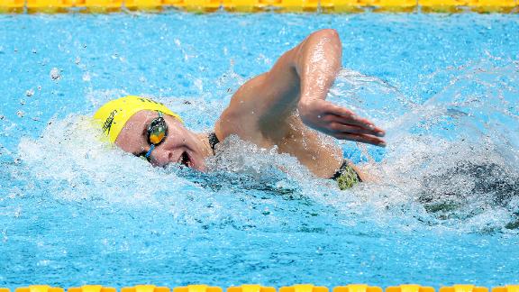 Australia's Ariarne Titmus swims her way to gold in the 200-meter freestyle on July 28. She also <a href=