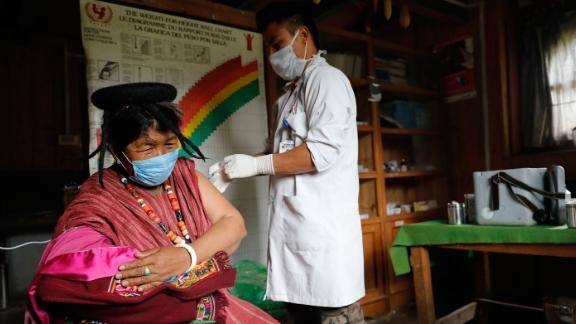 A resident of Sakteng village in far eastern district of Trashigang gets her second dose of Covid-19 vaccine at the community's health centre. 