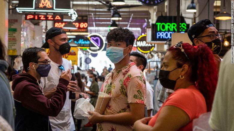 Visitors to the Grand Central Market in Los Angeles are mostly masked on Tuesday.