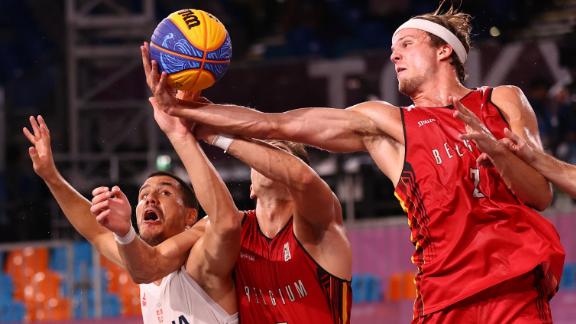 Serbia's Dusan Domovic Bulut, left, competes for the ball with Belgium's Rafael Bogaerts, center, and Thibaut Vervoort during a 3-on-3 basketball game on July 28. Serbia won the game for a bronze medal.