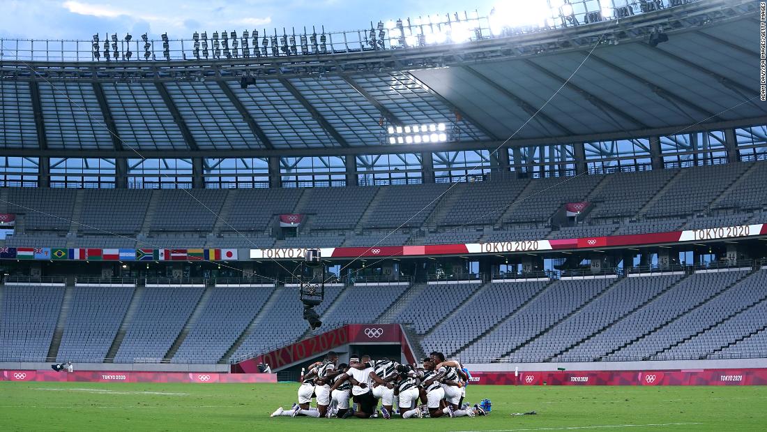 Fiji players celebrate after winning gold in rugby sevens on July 28.