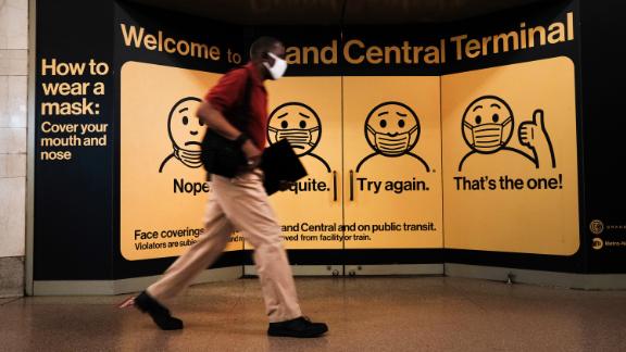 A person wears a mask while walking in Grand Central Terminal on July 27, 2021 in New York City. Due to the rapidly spreading Delta variant, the Centers for Disease Control and Prevention (CDC) has recommendedthat fully vaccinated people begin wearing masks indoors again in places with high Covid-19 transmission rates. 