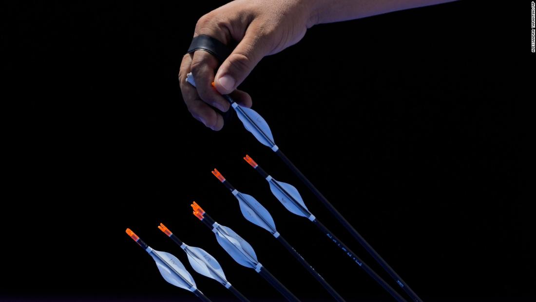 Tunisia&#39;s Mohamed Hammed picks an arrow during archery competition on July 29.