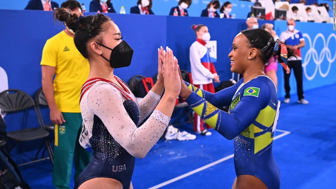 Lee congratulates Brazil&#39;s Rebeca Andrade after the floor exercise. Andrade had a chance to overtake Lee at the end, but she stepped out of bounds twice during her floor routine.