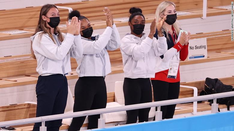 From left, US gymnasts Riley McCusker, Jordan Chiles, Simone Biles and MyKayla Skinner cheer for Lee after her gold-medal performance. Biles, the defending champion, withdrew from the event because of mental-health concerns.