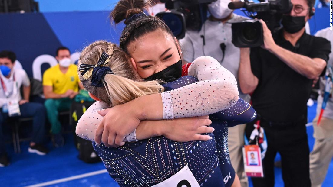Lee is congratulated by teammate Jade Carey after winning the gold.