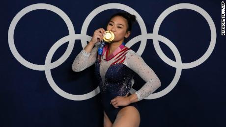 Sunisa Lee, of  the United States, reacts as she poses for a picture after winning the gold medal in the artistic gymnastics women&#39;s all-around final at the 2020 Summer Olympics, Thursday, July 29, 2021, in Tokyo, Japan. 