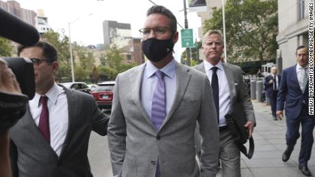 Trevor Milton, founder of Nikola Corp., center, exits federal court in New York, U.S., on Thursday, July 29, 2021. Milton is charged with misleading investors from November 2019 until around September 2020 about the development of Nikolas products and technology, according to an indictment unsealed Thursday by federal prosecutors in N.Y.