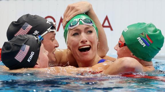 South African swimmer Tatjana Schoenmaker is congratulated by some of her fellow competitors — from left, American Lilly King, American Annie Lazor and South African Kaylene Corbett — after <a href=