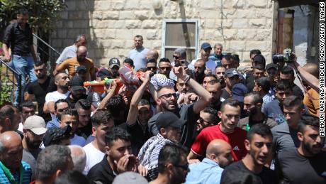 Mourners attend the funeral procession of 12-year-old Mohammad Allamy on Thursday. 