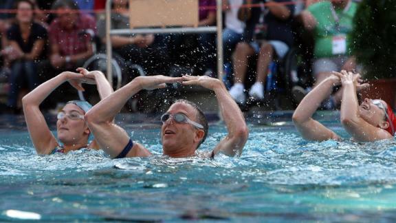 A team performs in the freestyle competition of the waterballet event of the 2010 Gay Games in Cologne, Germany.